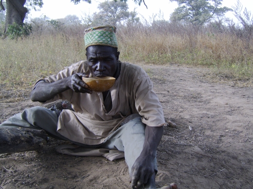 Audu Agulu drinking beer from a calabash